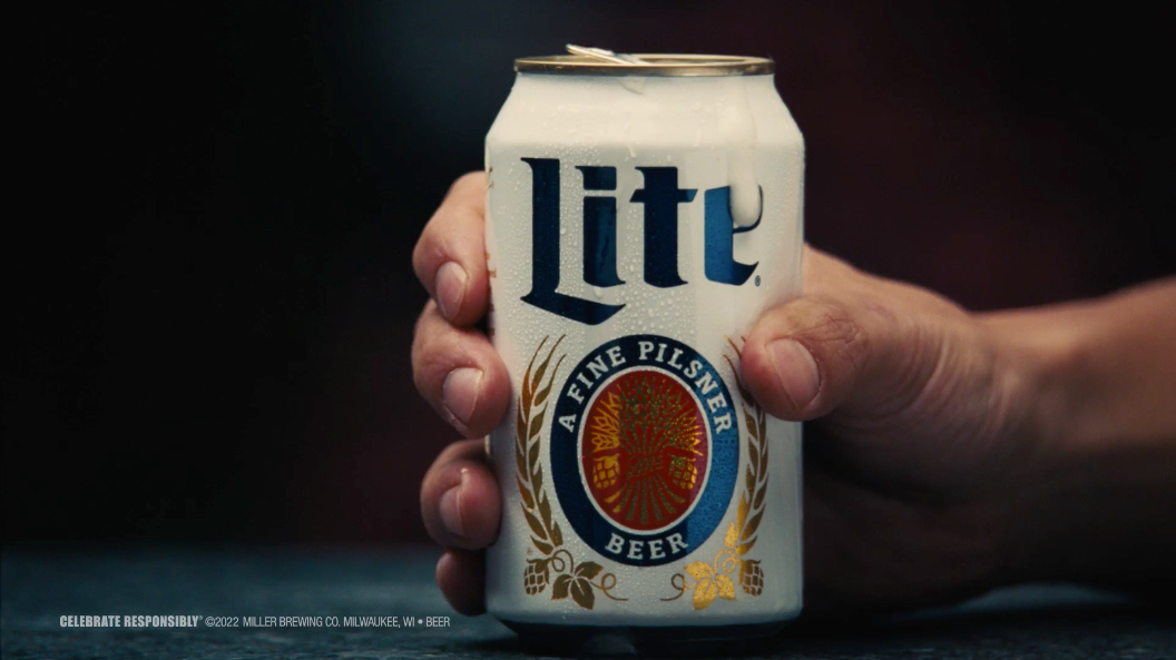 Miller Lite can with hand