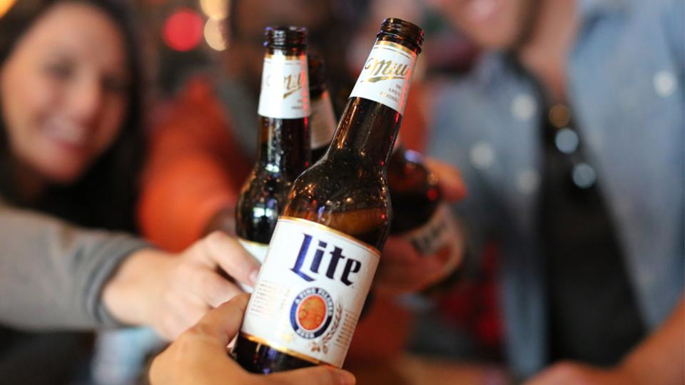 Friends holding Miller Lite beer